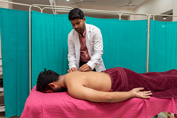 Patanjali acupuncture therapy on a patient